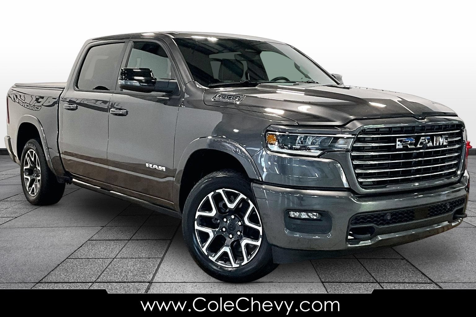 2026 RAM 1500 Laramie in Gray — front three-quarter view