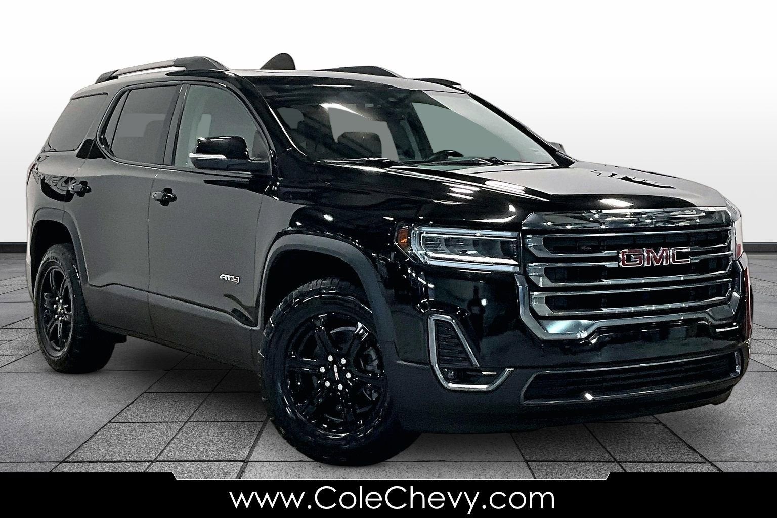 2022 GMC Acadia AT4 in Ebony Twilight Metallic — front three-quarter view