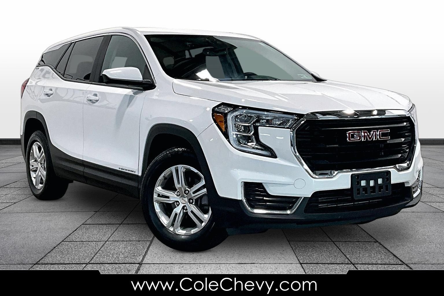 2024 GMC Terrain SLE in Summit White — front three-quarter view