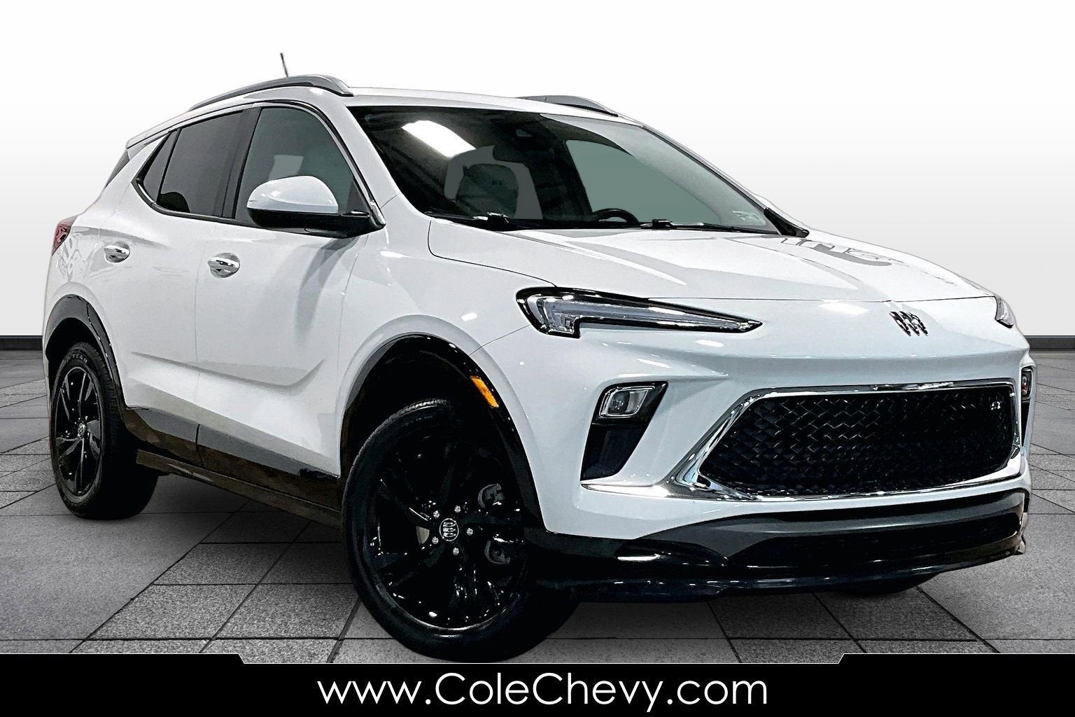 2024 Buick Encore GX Sport Touring in Summit White — front three-quarter view